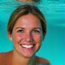 Headshot of Emma Roberts, Sustainable Fishing Consultant, with a backdrop of a healthy ocean.